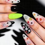 Long almond-shaped nails with a playful mix of translucent and solid colors, decorated with fun symbols like dice, hearts, flames, stars, and a smiley face—perfect swaggy nails for bold Nail Art Ideas.