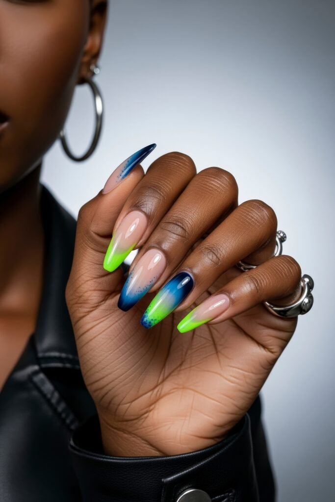 Swaggy Nails That Look Cool and Expensive 2 Glossy stiletto nails featuring a smooth gradient of navy blue to neon green with subtle speckled detailing, a fresh and swaggy take on Nail Art Ideas.