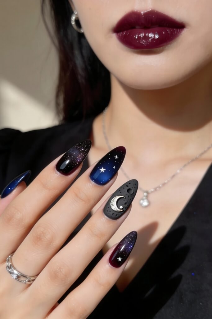 3d Nail Art Ideas That Look Luxe and Wearable 26 Almond nails painted in galaxy-inspired gradients of deep blue and black, with 3d nail art including a crescent moon, stars, and a textured matte moon accent, evoking a dreamy celestial theme.