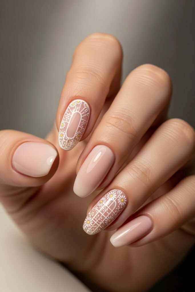 Elegant pink-toned nails with intricate white and yellow daisy patterns and lattice-like details, resembling spring windowpanes in a subtle Easter nail design.