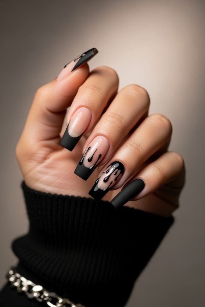 Swaggy Nails That Look Cool and Expensive 7 Square black French tips on nude nails with glossy black drip accents, combining matte and shine for a moody, swaggy nail design.