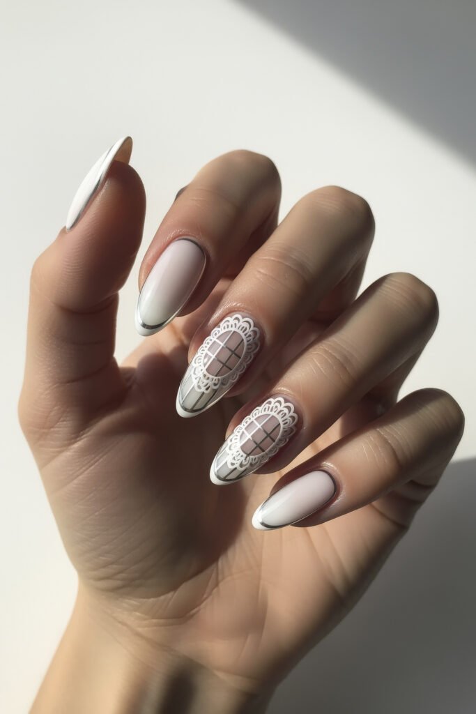 Milky White With Chrome Nails That Look Luxe 11 Almond nails with a milky white base, thin chrome tips, and intricate lace and windowpane-style designs on accent nails for a delicate, bridal-inspired look.