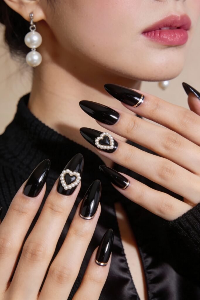 Black Valentines Day Nails That Feel Chic And Romantic 15 Elegant black valentines day nails with high-gloss finish and pearl-embellished heart accents on ring fingers, styled with a formal outfit and pearl earrings.