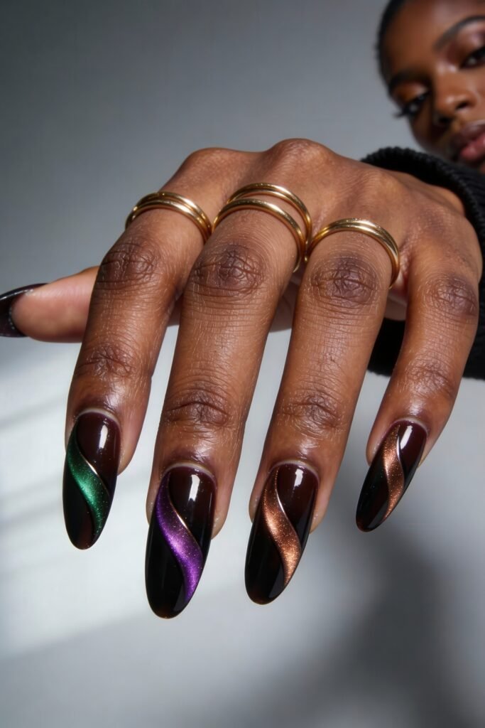 Swaggy Nails That Look Cool and Expensive 15 Glossy dark brown almond nails featuring rich metallic swirls in green, purple, and bronze tones—moody, radiant, and undeniably swaggy nails.