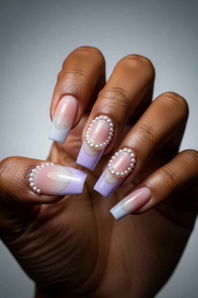 Square lavender ombré French tips with oval pearl frames, combining pastel gradients and pearl accents in a fresh, elegant Easter nails aesthetic.