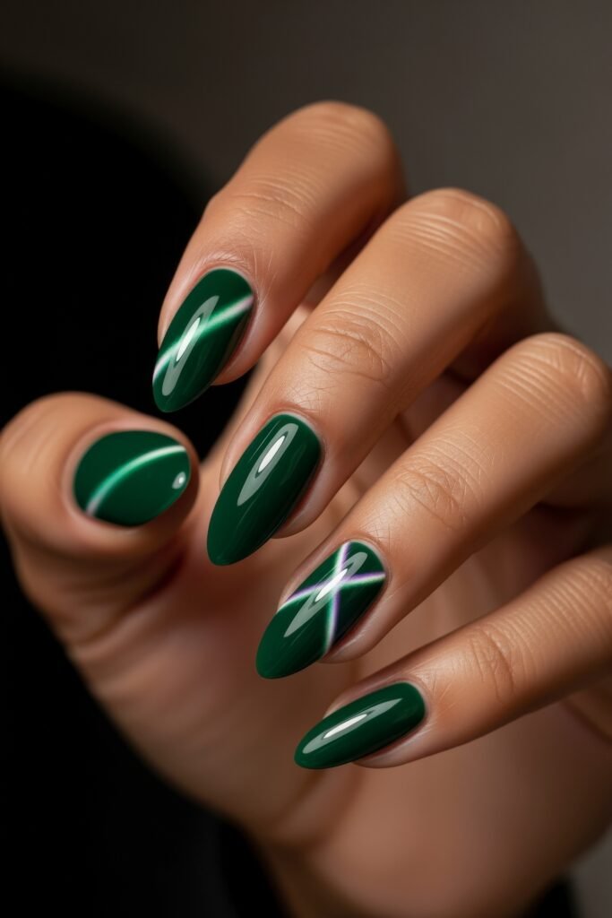 Fresh, Luxe Spring Nail Designs You’ll Want to Save 17 Glossy emerald green nails with a cat-eye effect and reflective cross accent, adding a bold yet polished option to spring nails.