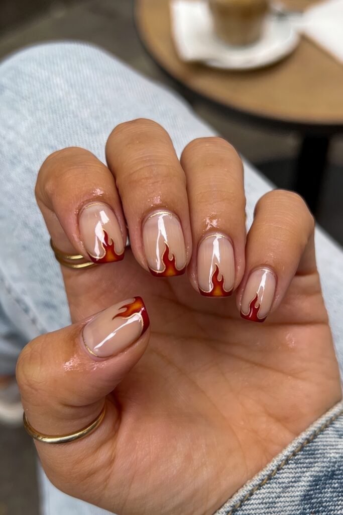 Fire Nails That Look Expensive and Feel Effortless 13 Short square Fire Nails with nude base and red-orange flame French tips