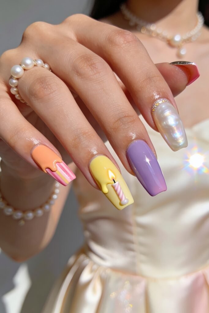 Summer Birthday Nails That Feel Fresh and Fun 6 Hand with pastel nails featuring peach and yellow drip art a candle design a glossy lavender nail and a raised pearl effect accent
