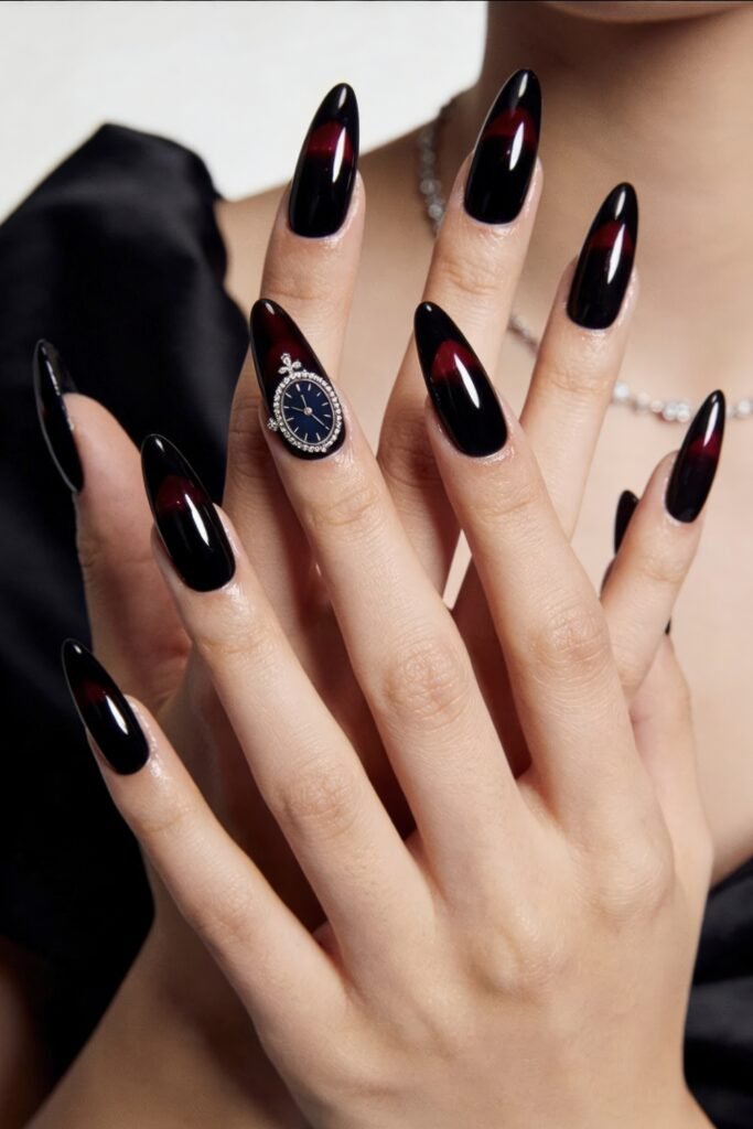 Elegant black and deep red cat-eye almond nails with one accent nail featuring a watch-shaped jewel design