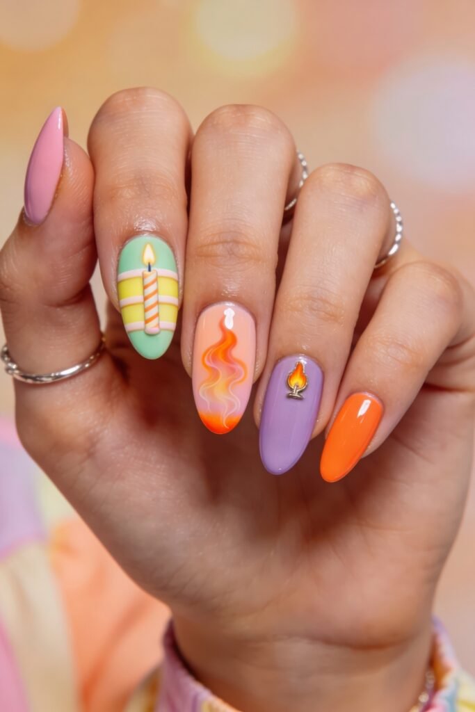 Summer Birthday Nails That Feel Fresh and Fun 14 Hand with colorful almond nails featuring a mint candle design orange flame art lavender charm detail and a bright orange accent nail