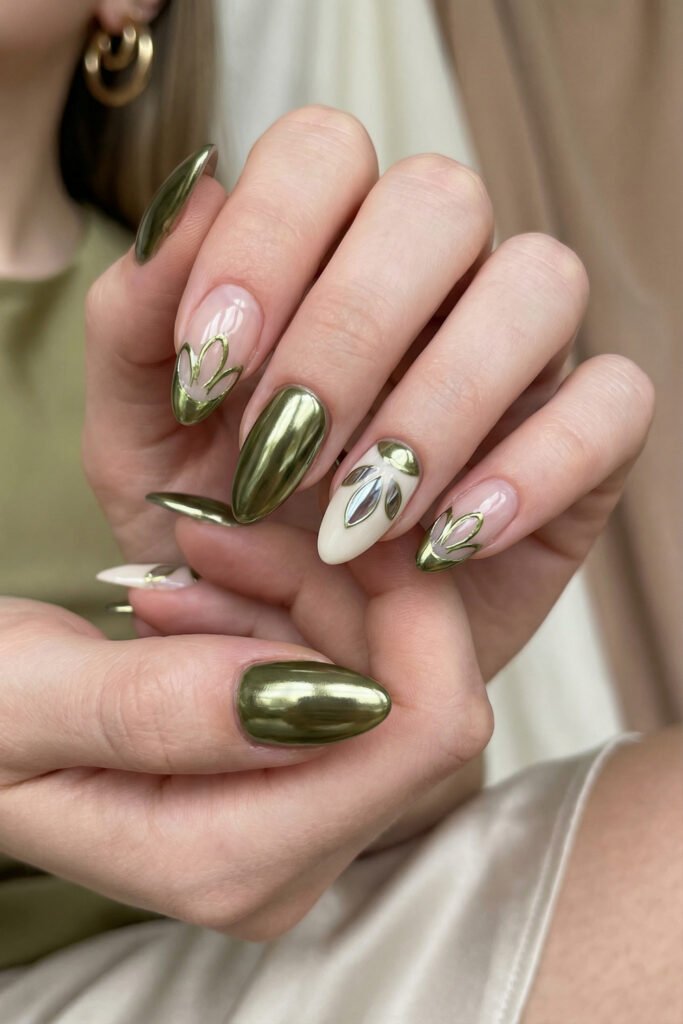 Spring Summer Nails That Feel Fresh and Easy 14 Bold olive green spring summer nails with chrome finish, abstract French accents, and an ivory accent nail with silver mirrored leaf detail.
